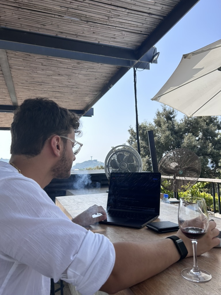 Chris working at a café table.